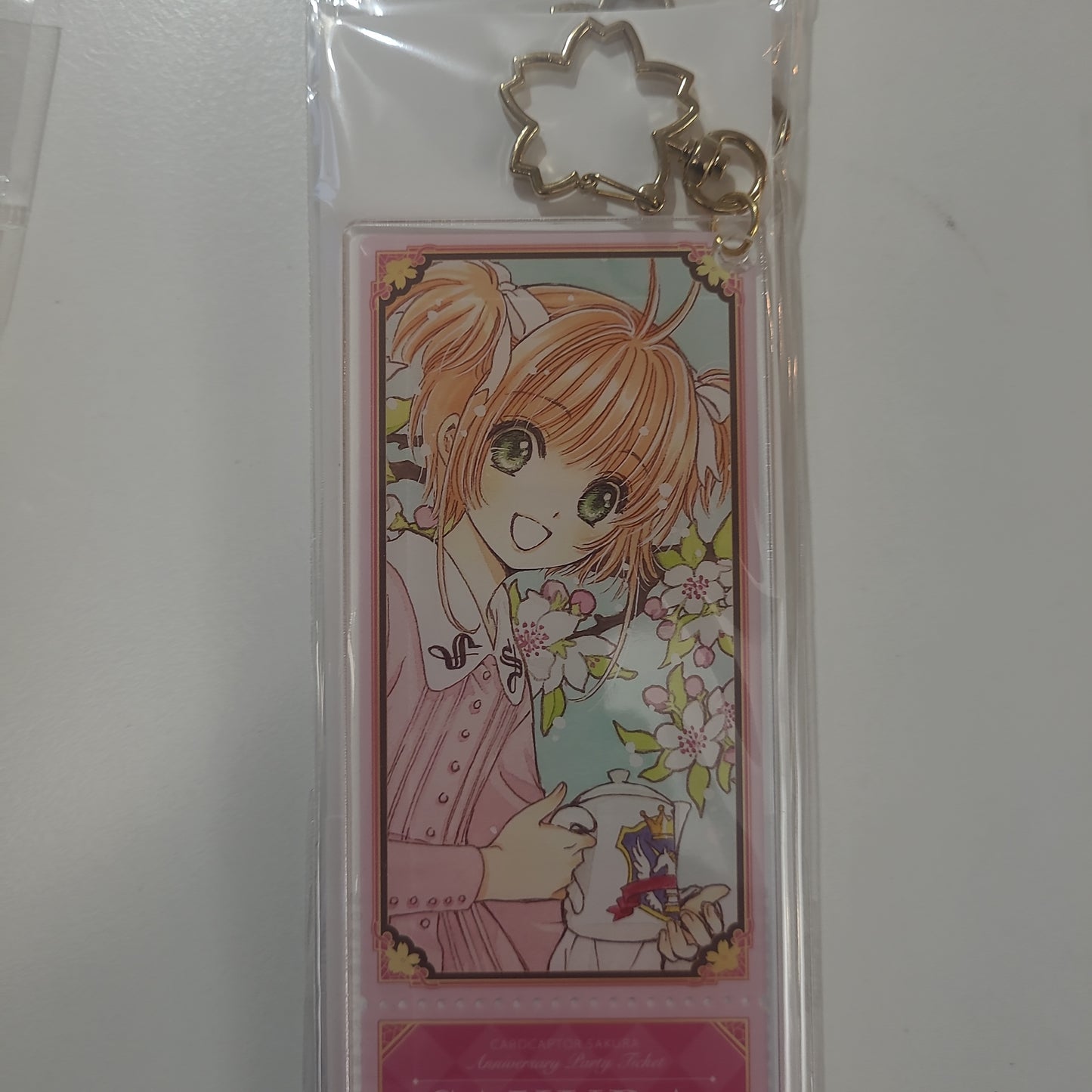 カードキャプターさくら　アクリルチケットキーホルダー ピンク小櫻襟章as.