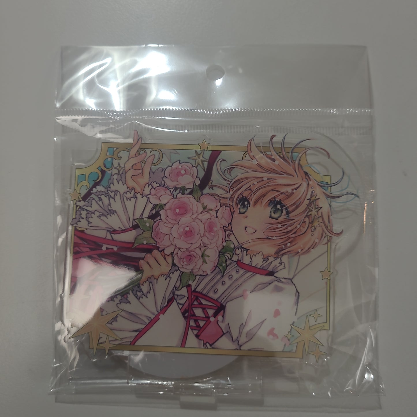 カードキャプターさくら　さくらちゃんお誕生日アクリルスタンド　オレンジ 小櫻襟章as.